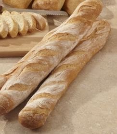 on trend bakery products baguette on pale background